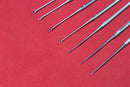 Buck Ear Curette Set of 7 Piece Sharp Point Round handle overall length 6.5"